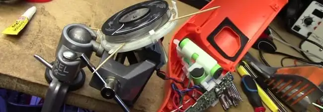 Vacuum cleaner repair parts and tools on a workbench in Hollywood, FL